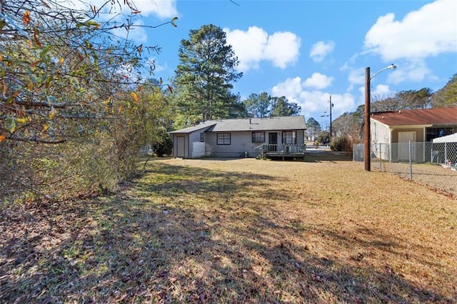 view of yard with a wooden deck