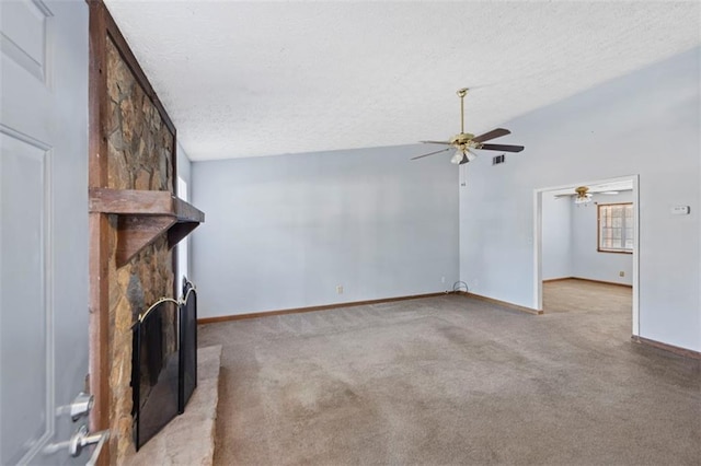 unfurnished living room with a fireplace, a wealth of natural light, and light carpet