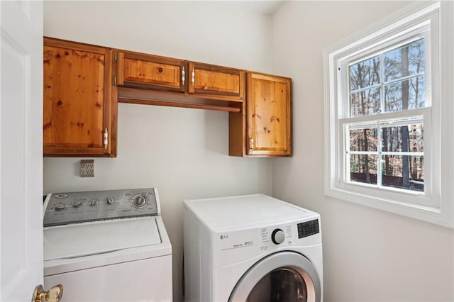 laundry area with cabinet space and washing machine and dryer