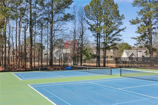 view of sport court with fence