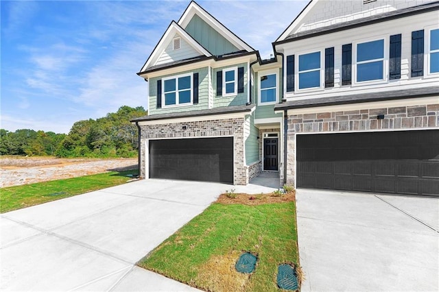 view of front of property with concrete driveway, an attached garage, and brick siding