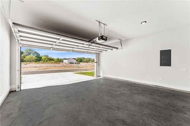 garage featuring electric panel and a garage door opener