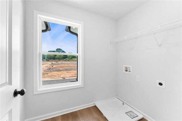 laundry room with hookup for an electric dryer, hardwood / wood-style floors, and washer hookup