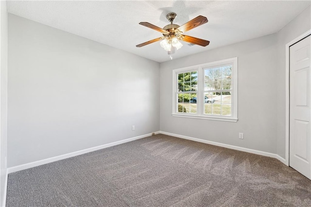 empty room featuring carpet and ceiling fan