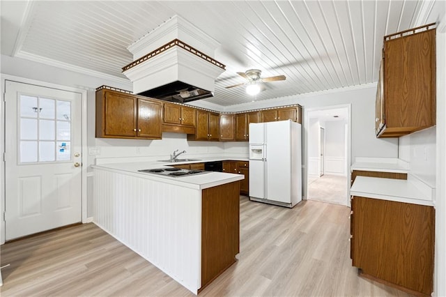 kitchen featuring ceiling fan, light hardwood / wood-style flooring, white refrigerator with ice dispenser, and ornamental molding