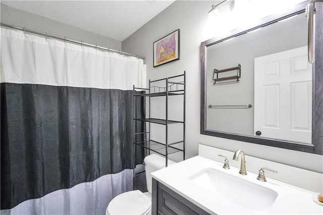 full bathroom with vanity, curtained shower, and toilet