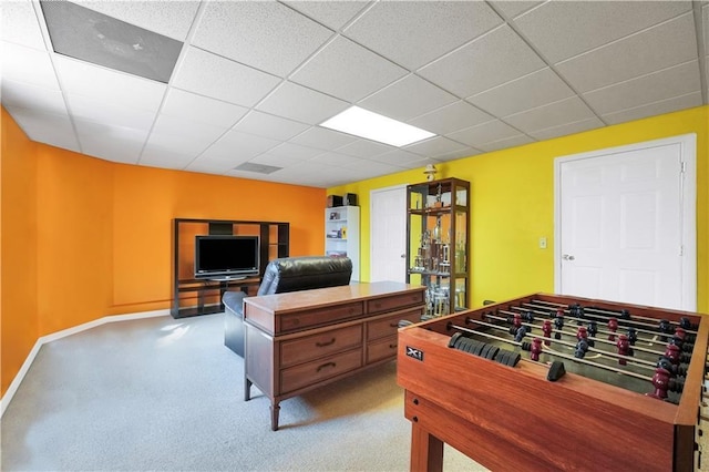 game room featuring a paneled ceiling, baseboards, and carpet floors