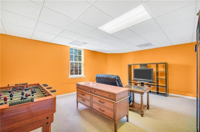 game room featuring a drop ceiling, light carpet, and baseboards