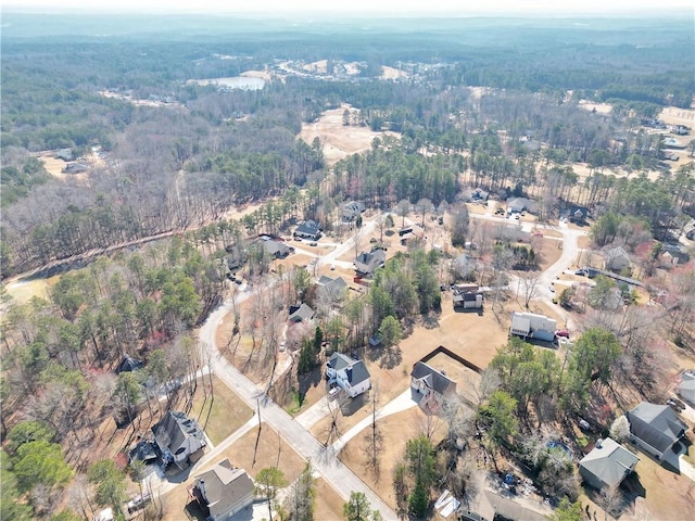 bird's eye view featuring a forest view