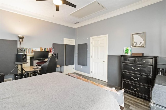 bedroom featuring ceiling fan, dark hardwood / wood-style flooring, and crown molding