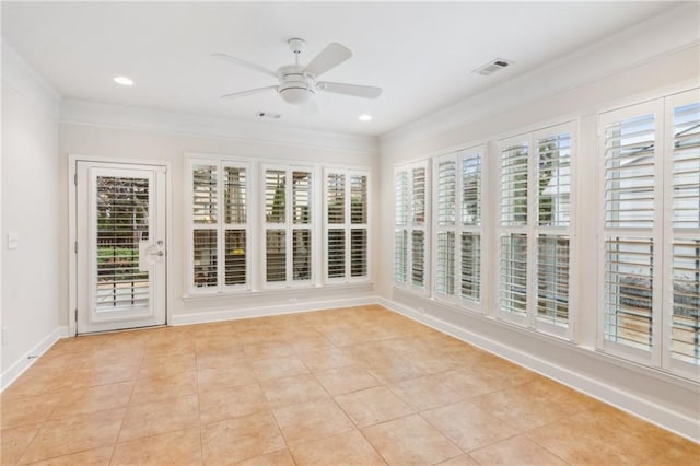 unfurnished sunroom with visible vents and ceiling fan