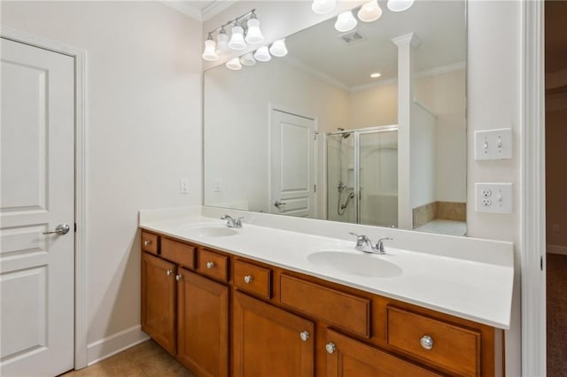 bathroom featuring double vanity, visible vents, a shower stall, and a sink