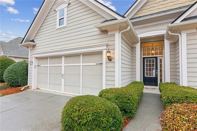 property entrance featuring aphalt driveway