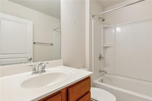 full bathroom featuring shower / bathing tub combination, toilet, and vanity