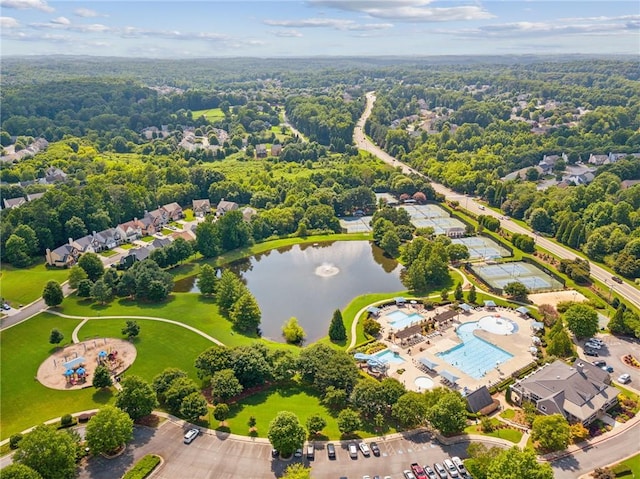 aerial view with a water view and a view of trees