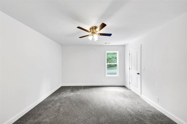 unfurnished room with carpet flooring, a ceiling fan, and baseboards