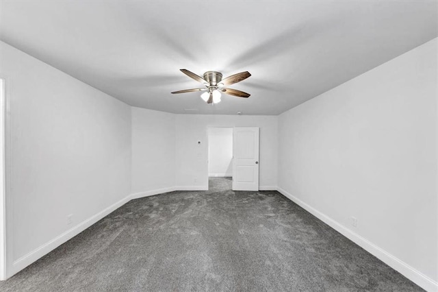 carpeted empty room featuring ceiling fan and baseboards