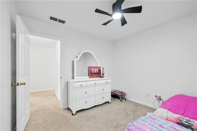 bedroom featuring light carpet, baseboards, and a ceiling fan