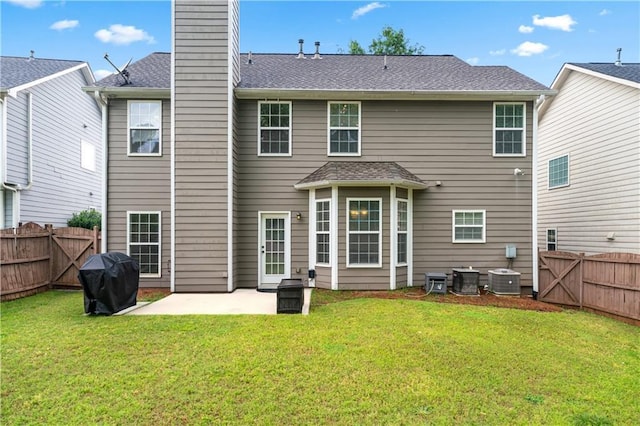 rear view of house featuring a patio area and a chimney
