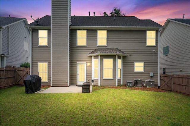 rear view of property with a patio and a chimney