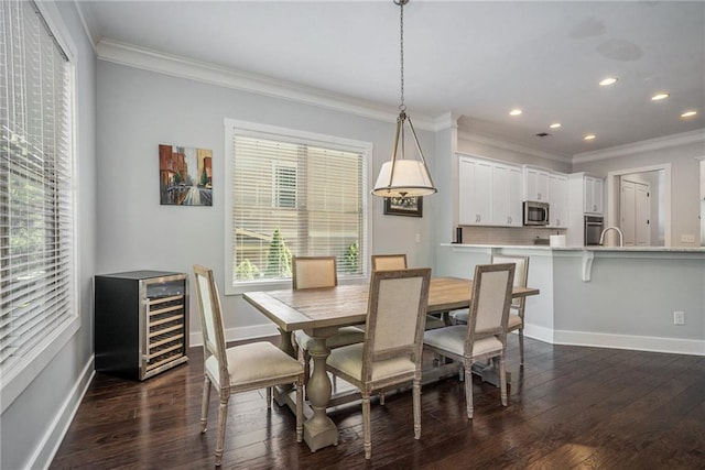 647 E Ave NE, Atlanta, GA 30312 - dining area featuring wine cooler, ornamental molding, recessed lighting, and dark wood-style floors