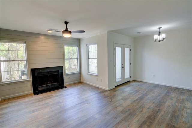 3263 Long Iron Pl, Lawrenceville, GA 30044 - unfurnished living room featuring wood finished floors, a chandelier, baseboards, and ornamental molding