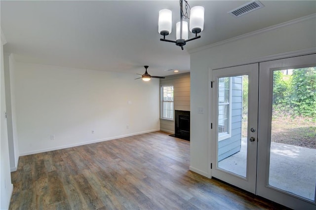3263 Long Iron Pl, Lawrenceville, GA 30044 - unfurnished living room featuring ornamental molding, wood finished floors, baseboards, a ceiling fan, and a fireplace