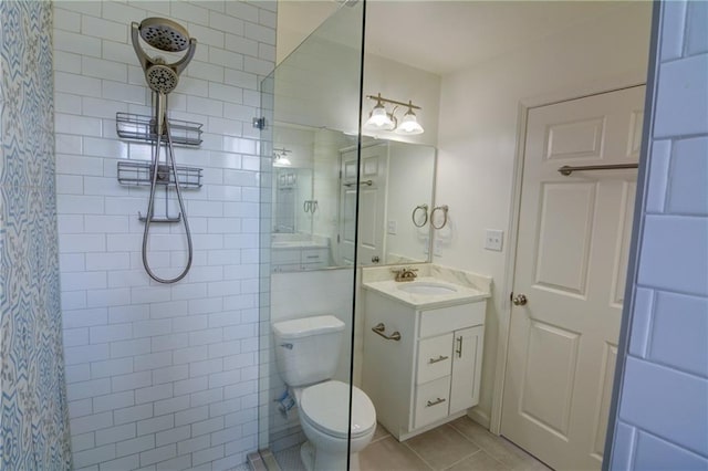 3263 Long Iron Pl, Lawrenceville, GA 30044 - bathroom featuring tiled shower, toilet, tile patterned flooring, and vanity