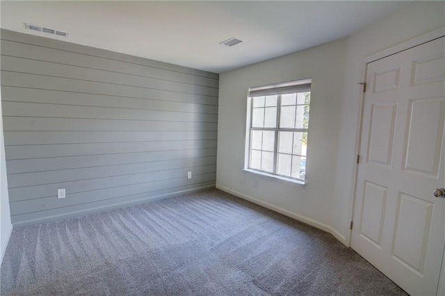 3263 Long Iron Pl, Lawrenceville, GA 30044 - carpeted empty room with baseboards and wooden walls