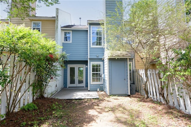 3263 Long Iron Pl, Lawrenceville, GA 30044 - rear view of property with french doors, a fenced backyard, a chimney, and a patio area
