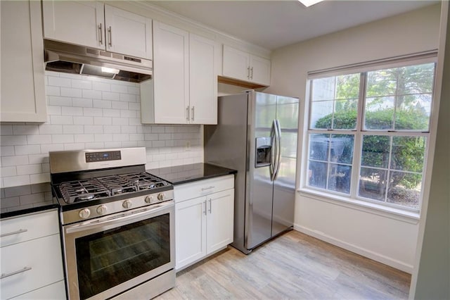 3263 Long Iron Pl, Lawrenceville, GA 30044 - kitchen with appliances with stainless steel finishes, under cabinet range hood, dark countertops, light wood finished floors, and white cabinets