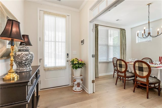 15 Lakeside Way, Cartersville, GA 30121 - foyer entrance featuring a chandelier, crown molding, light wood-style flooring, plenty of natural light, and baseboards
