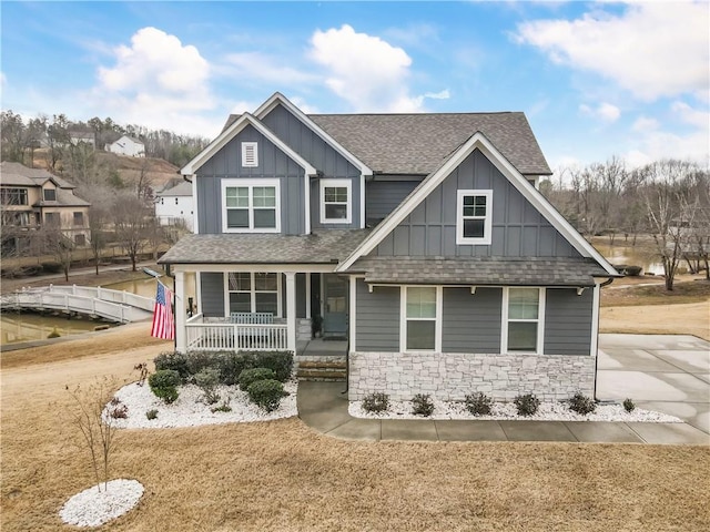 15 Lakeside Way, Cartersville, GA 30121 - craftsman inspired home with board and batten siding, a shingled roof, a porch, stone siding, and a front yard