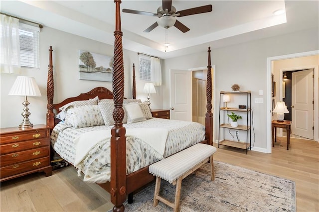 15 Lakeside Way, Cartersville, GA 30121 - bedroom with light wood-type flooring, a tray ceiling, baseboards, and ceiling fan