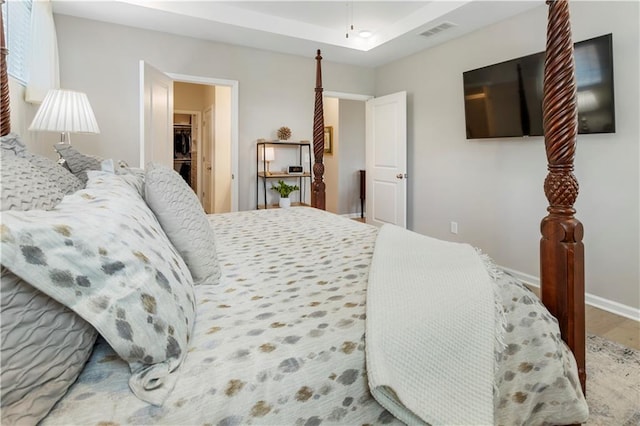 15 Lakeside Way, Cartersville, GA 30121 - bedroom with wood finished floors, baseboards, and a tray ceiling
