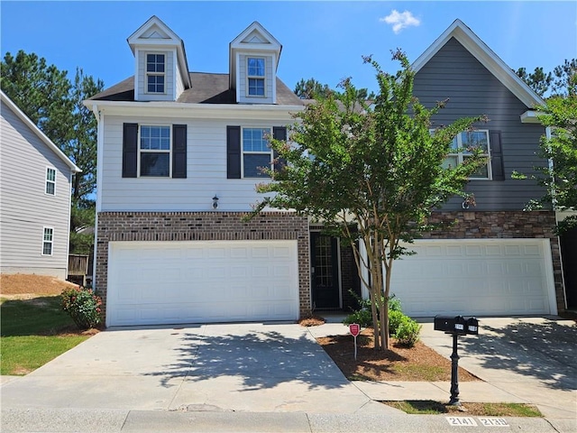 2141 Spikerush Way, Buford, GA 30519 - view of front of property with an attached garage, concrete driveway, and brick siding