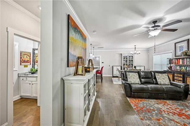 4571 Academy St, Acworth, GA 30101 - living room with ornamental molding, a chandelier, ceiling fan, and hardwood / wood-style floors