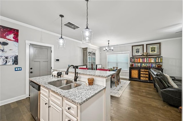 4571 Academy St, Acworth, GA 30101 - kitchen featuring stainless steel dishwasher, ornamental molding, dark wood-style flooring, a chandelier, and an island with sink