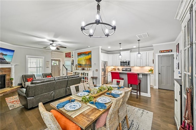 4571 Academy St, Acworth, GA 30101 - dining space featuring a chandelier, ornamental molding, a ceiling fan, dark wood finished floors, and recessed lighting