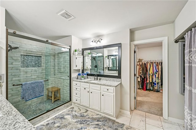 4571 Academy St, Acworth, GA 30101 - full bathroom with vanity, marble look tiles, a stall shower, and a spacious closet
