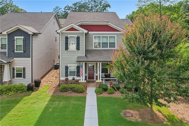 4571 Academy St, Acworth, GA 30101 - view of front facade with covered porch, a front yard, and a shingled roof