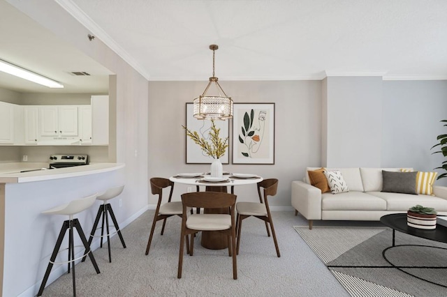 carpeted dining room with an inviting chandelier and crown molding