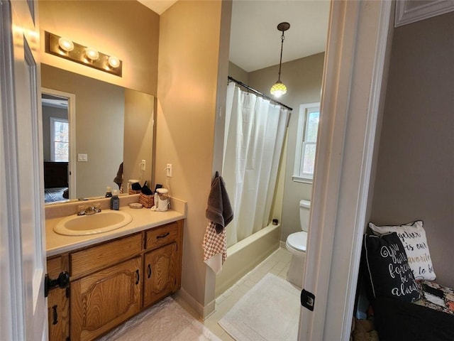 full bath featuring toilet, shower / tub combo with curtain, vanity, and a healthy amount of sunlight