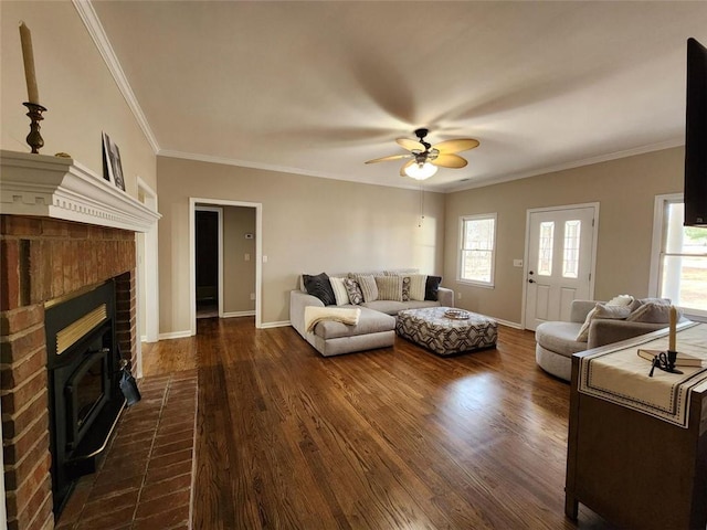 living room with dark wood-style floors, a wealth of natural light, and baseboards