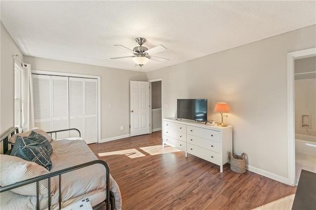 bedroom with hardwood / wood-style flooring, ceiling fan, and a closet