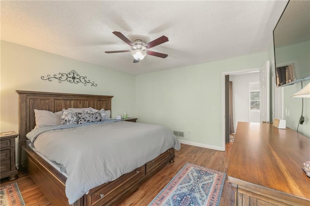 bedroom featuring ceiling fan and light hardwood / wood-style floors