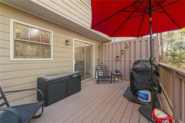 wooden deck featuring area for grilling