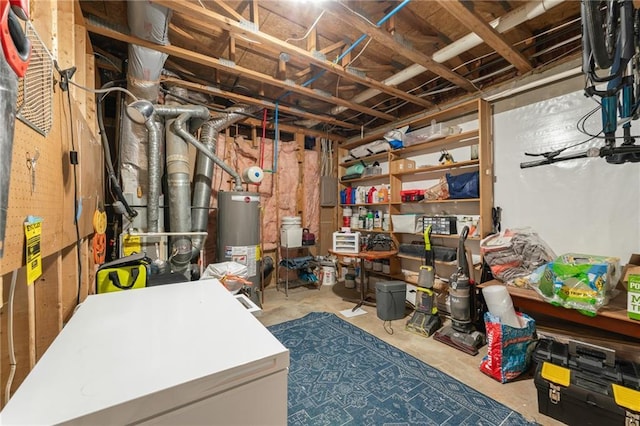 basement featuring water heater and refrigerator