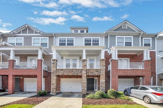 view of property with a balcony and a garage