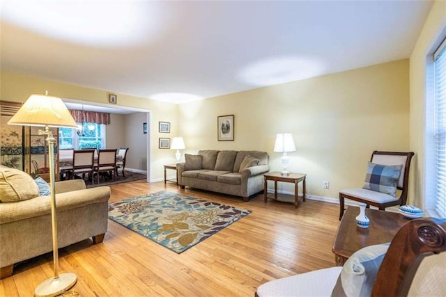living room featuring wood finished floors and baseboards